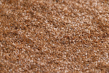 flax seeds for closeup sowing, a large number of light brown flax seeds for a new crop or germination for nutrition