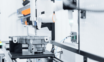 Cnc coordinate measuring machine inspecting metal component in precision engineering lab conveyor