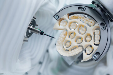 Cnc machine crafting precision dental veneers prosthesis for modern dentistry © Parilov