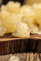 yellow juicy citrus fruit peeled, pieces of delicious and sweet citrus fruit while preparing it for eating, closeup