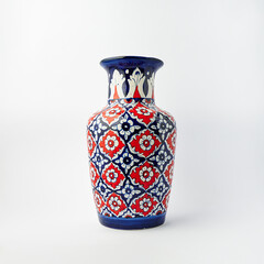 Beautiful blue and red pottery vase isolated on white background for decoration