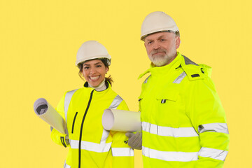 Construction professionals collaborate on a project while showcasing safety gear and planning documents in a studio setting