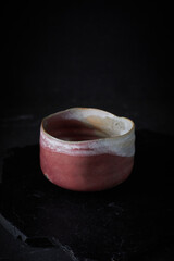 Tea bowl ceramic on dark background.