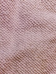 Close up of pink knitted wool fabric texture background