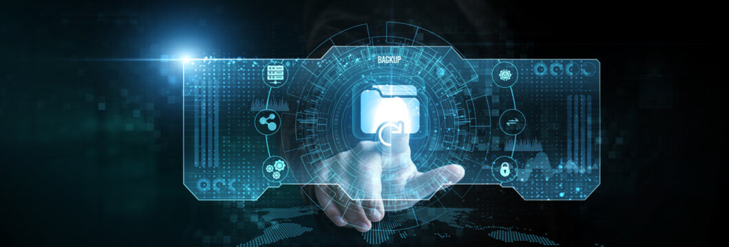 Businessman touching the backup icon on the digital screen analysing data. data recovery, disaster protection, secure cloud storage, system restore, file synchronization.