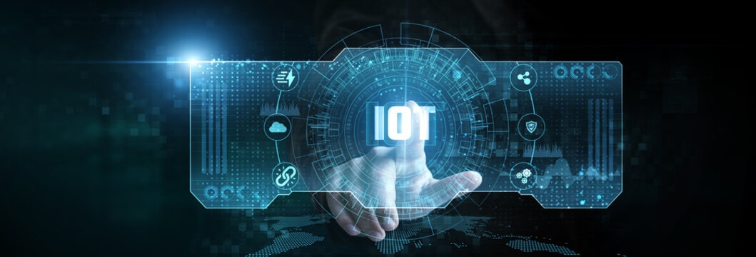 Businessman touching the IoT network icon on the digital screen analyzing data. smart devices, connected ecosystems, real-time monitoring, automation control, cloud integration.
