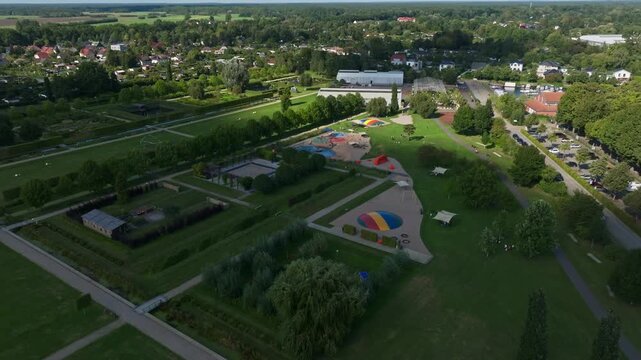 Aerial drone view of Schlosspark Oranienburg, the baroque palace park and gardens surrounding Oranienburg Castle in Brandenburg, Germany, historic landmark and cultural attraction. 15 September 2024
