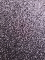 Close up textured view of dark gray carpet surface background