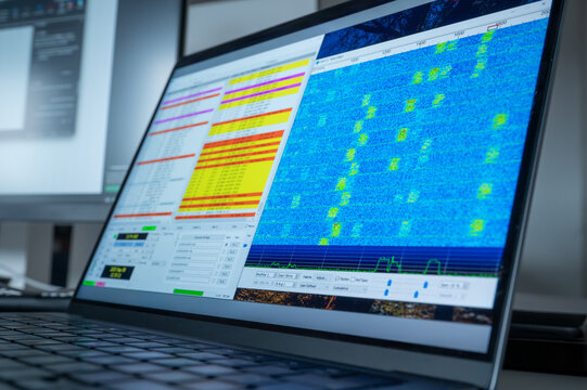 Laptop screen running WSJT-X software used in amateur radio for digital communication modes such as FT8, FT4, JT65, MSK, and Q65. Display shows waterfall spectrum analyzer for decoding weak signals.