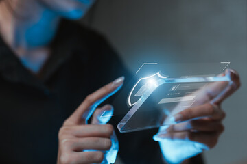 Person using transparent futuristic smartphone with digital login screen and security shield icon. Concept of cybersecurity, data protection, privacy and secure technology innovation.