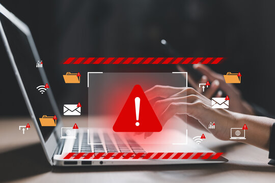 Cybersecurity warning on laptop screen with alert icons, indicating data breach, phishing, or malware risk. Concept of online threat, hacker attack and information security.