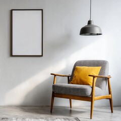 A stylish, modern living room setting features a gray upholstered armchair with a mustard yellow accent pillow, a blank picture frame, and a pendant light against a light gray wall.