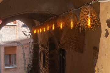 Warm Lanterns Illuminate Rustic Alleyway at Dusk