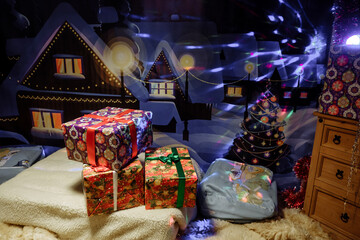 Fototapeta premium Festive scene with Christmas gifts and a winter backdrop.