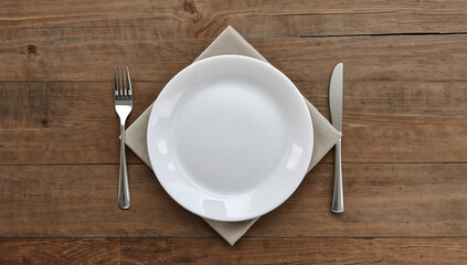 Minimalist Dining Table Setting with Empty Plate and Cutlery