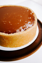 Delicious dessert displayed on a round wooden tray in a bright kitchen environment