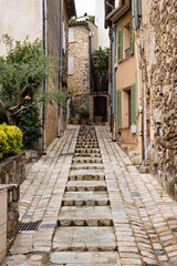 Obraz premium typical street of Grimaud with houses and plants in France in spring