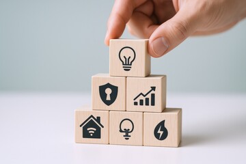 Building Blocks Representing Smart Home Technology, Energy Efficiency, Security, and Growth, Hand Adding Final Piece