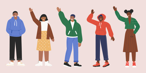 Diverse group of five young people in casual clothing waving hello against a pale background