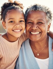 close up portrait of a mature african american grandmother with her grandson