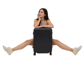 Pensive young woman sitting with legs stretched over a travel suitcase waiting to depart on a trip