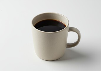 A light beige mug filled with dark coffee, presented against a plain white background.