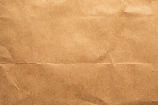 vintage brown crumpled and fold paper texture background,old paper background,craft parchment paper background,old paper background - Powered by Adobe