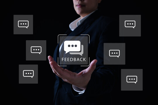 Customer feedback concept as businesswoman presents virtual chat bubbles, representing online review system, client opinion collection, and user experience improvement in digital business. - Powered by Adobe