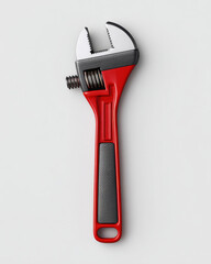 Naklejka premium Adjustable wrench with red and black handle isolated on white background, tool for gripping and turning nuts and bolts, practical and durable design for repair work