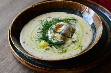 Traditional Czech dill soup Kulajda — a creamy soup made with mushrooms, potatoes, poached egg, and fresh dill. A comforting and flavorful dish from Czech cuisine, served warm and perfect for autumn.