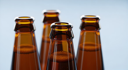 Close up shot showcases brown glass beer bottles filled with liquid against light background