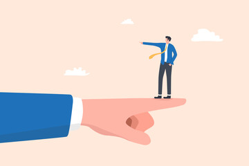 Businessman Standing on Giant Hand Pointing Right While Pointing Left, symbolizing disagreement, opposite direction, or conflict in business decisions.