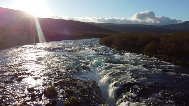 Aerial Glacial River Crevasse Br&uacute;arfoss Waterfall Iceland sun flare