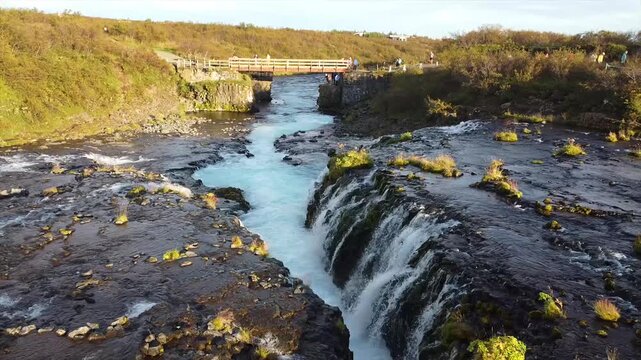 Aerial Overview of Br&uacute;arfoss Waterfall Iceland - Tourists on Bridge