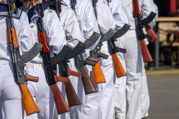 Military Parade with Soldiers in White Uniforms Carrying Rifles. Armed Forces Ceremony, Navy Cadets...