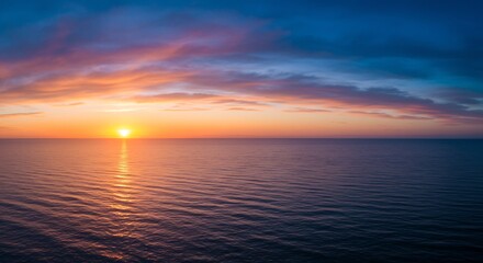 Obraz premium 穏やか夕日 海面輝く 美しい光景 広がる空. AI Generated