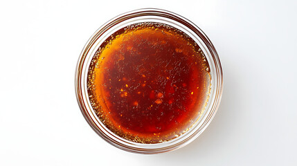 A top view of a glass bowl containing a dark red liquid with particles