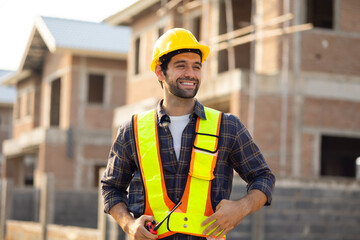Radio Hispanic male engineer talking on walkie talkie transmitter, radio : Architect, contractor and architecture standing in house building under construction site.safety harthat helmet, teamwork