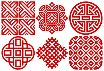 Collection of six red traditional geometric ornaments with circular square and diamond lattice motifs in decorative symmetry.