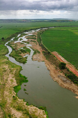 Fototapeta premium Deforested riverbanks for agriculture along the Paraíba River in Cruz do Espírito Santo, Paraíba, Brazil, on May 8, 2010.