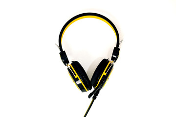 Close-up shot of yellow and black headphones on a clean white background