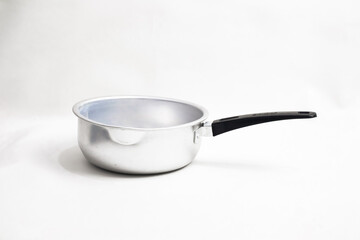 Isolated aluminum saucepan with black handle on a white background for cooking