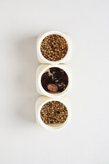 Minimalist Spice Jars: An Overhead Shot of Culinary Ingredients in White Containers