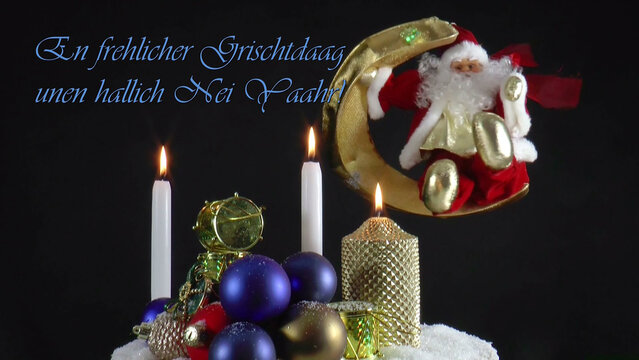 Warm Wishes for Christmas Joy 
A festive card with candles, baubles, and Santa Claus in the language Pennsylvania German
