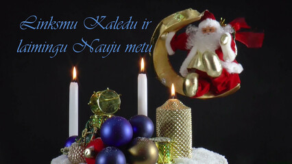 Warm Wishes for Christmas Joy 
A festive card with candles, baubles, and Santa Claus in the language Lithuanian 
