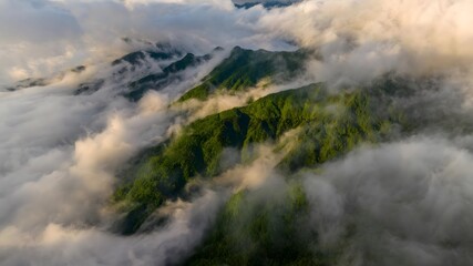 Aerial View of Misty Mountain Peaks with Rolling Clouds in Yichang China Creating Dramatic Landscape
