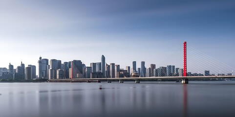 Naklejka premium Hangzhou City Skyline with Cable-Stayed Bridge Reflected in River During Blue Hour Twilight