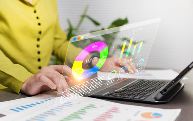 Economic market analysis data graph, investment, financial growth percentage, data research from 2026 to 2028. Businesswoman working with a laptop device with a virtual graph on screen.