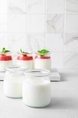 homemade yogurt in jars with strawberries