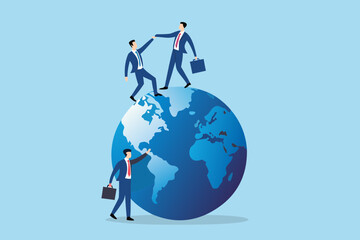 Businessmen collaborating on a globe representing global teamwork and international business success